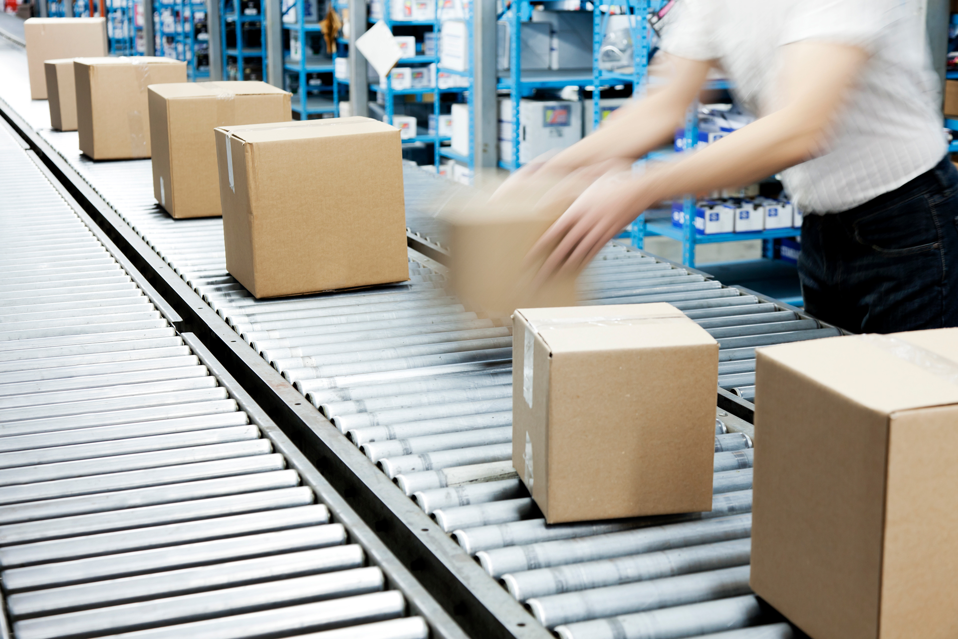 Boxes being loaded on conveyor rollers